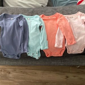 Never worn Carters preemie onesies. Never worn.